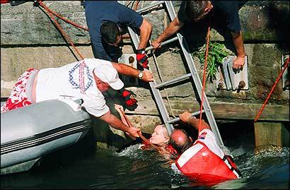 Firefigher rescues paddlers from culvert